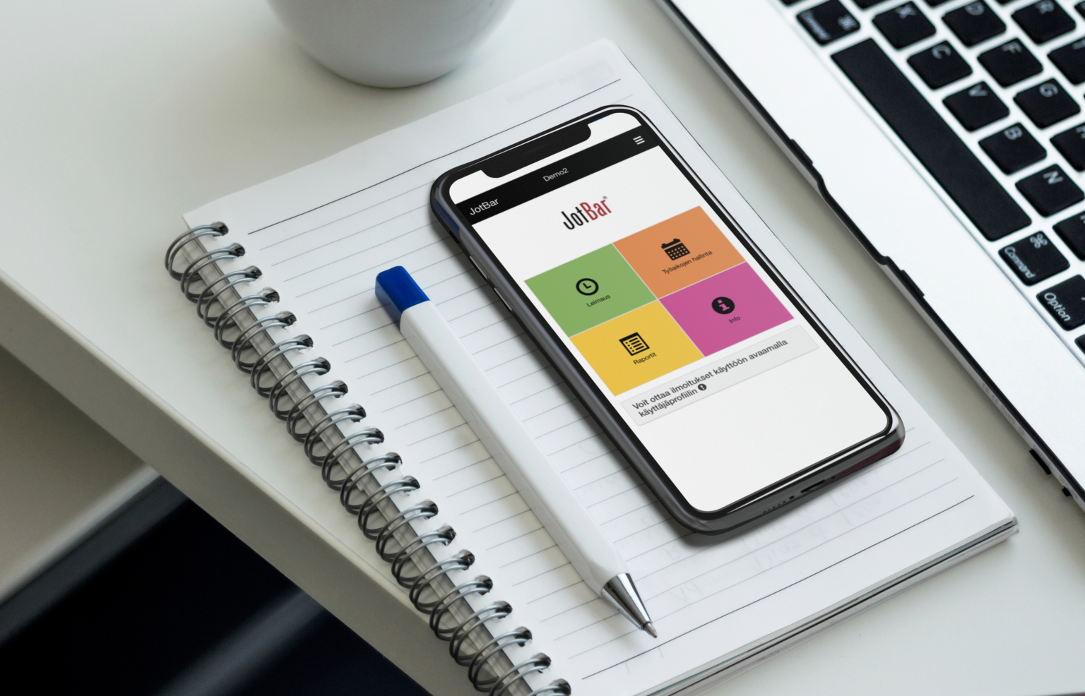 mockup-of-an-iphone-x-lying-on-an-office-desk-a17390-e1677479022669-1536x986